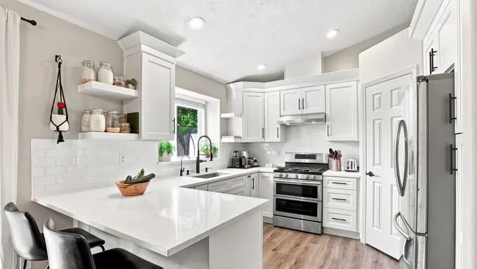 Solid surface countertop with undermount sink on white oak base cabinets