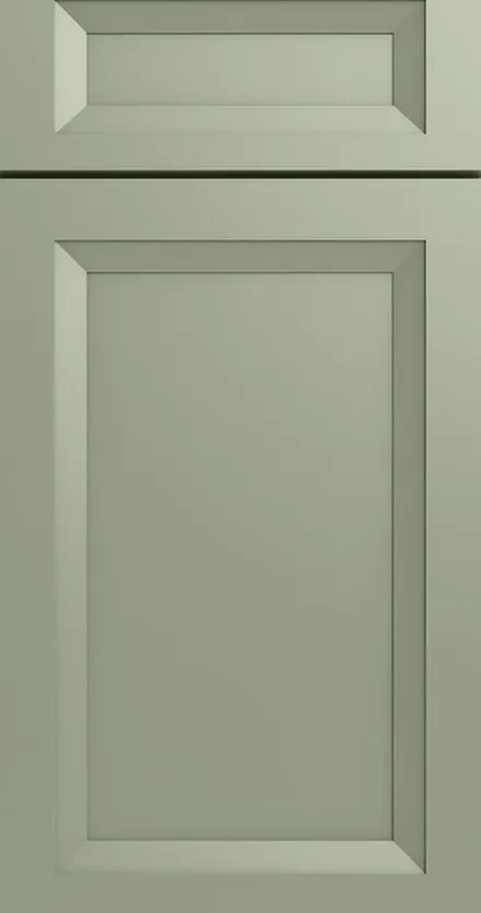 Sage green cabinet doors with beveled frame-and-panel design and professional finish