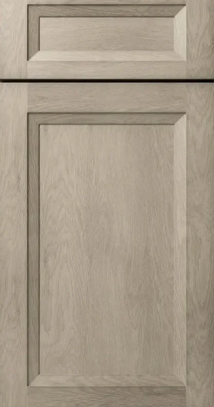 Light oak cabinet door with recessed frame-and-panel design and horizontal rail detail