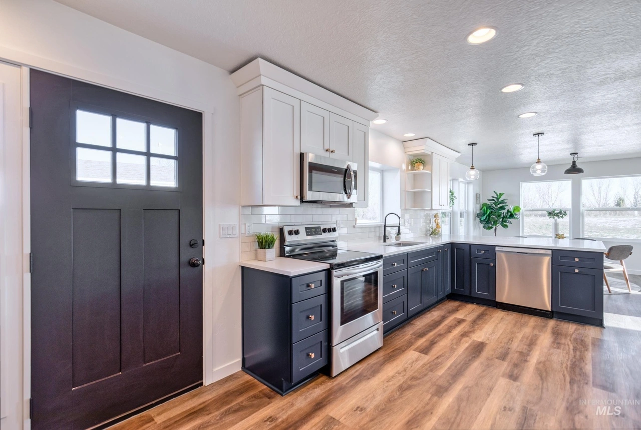 Kitchen with beautiful cabinets in blue shaker color.